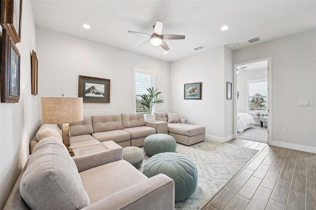 17838 Hither Hills Cir, Winter Garden, FL 34787 - living area with ceiling fan, healthy amount of natural light, wood finished floors, and recessed lighting