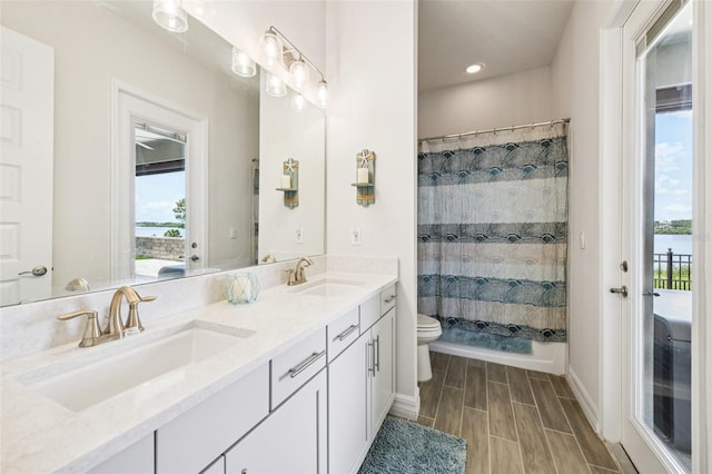 17838 Hither Hills Cir, Winter Garden, FL 34787 - bathroom with plenty of natural light, double vanity, curtained shower, and recessed lighting