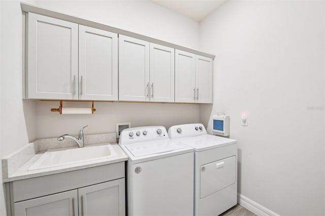 17838 Hither Hills Cir, Winter Garden, FL 34787 - laundry room with washer and clothes dryer and cabinet space