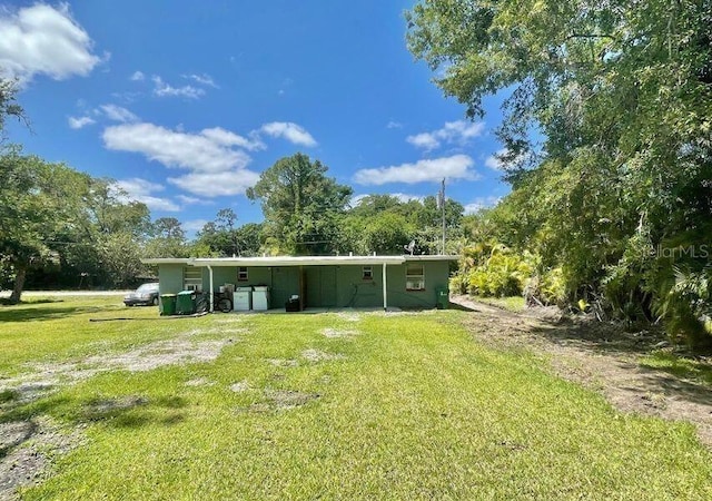 316AND318 Bay Ave, Cocoa, FL 32922 - rear view of property with a yard and view of scattered trees