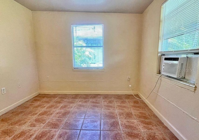 316AND318 Bay Ave, Cocoa, FL 32922 - tiled spare room featuring baseboards and cooling unit