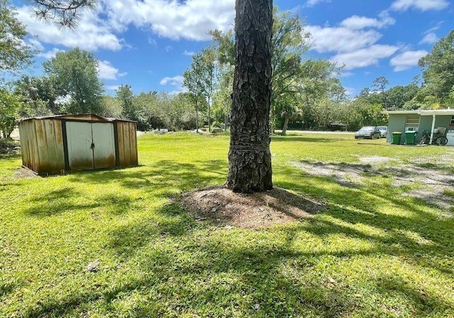 316AND318 Bay Ave, Cocoa, FL 32922 - view of grassy yard with a storage unit