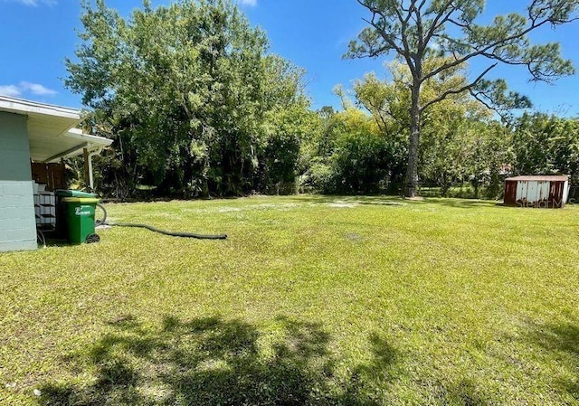 316AND318 Bay Ave, Cocoa, FL 32922 - view of grassy yard with a shed