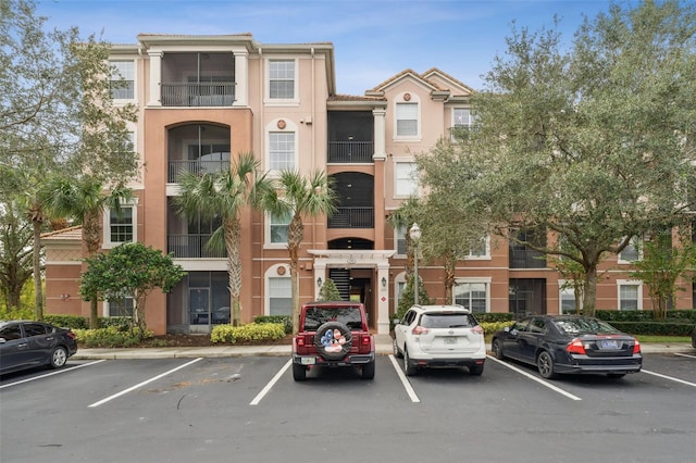 1355 Venezia Ct Unit 201, Davenport, FL 33896 - view of property featuring uncovered parking