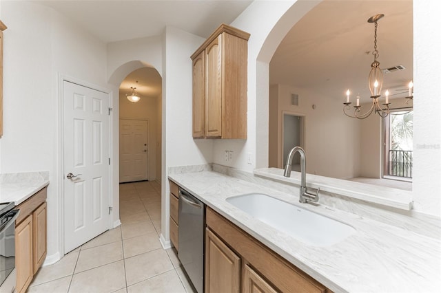 1355 Venezia Ct Unit 201, Davenport, FL 33896 - kitchen featuring stainless steel appliances, light tile patterned floors, arched walkways, and a chandelier