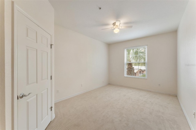 1355 Venezia Ct Unit 201, Davenport, FL 33896 - unfurnished room featuring light carpet, a ceiling fan, and a pendent fire sprinkler