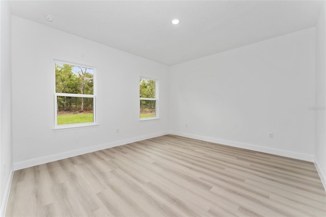 9312 N Akola Way, Citrus Springs, FL 34434 - empty room featuring plenty of natural light, light wood-style floors, and recessed lighting
