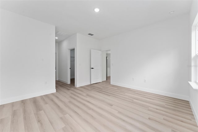 9312 N Akola Way, Citrus Springs, FL 34434 - spare room featuring light wood-type flooring and recessed lighting