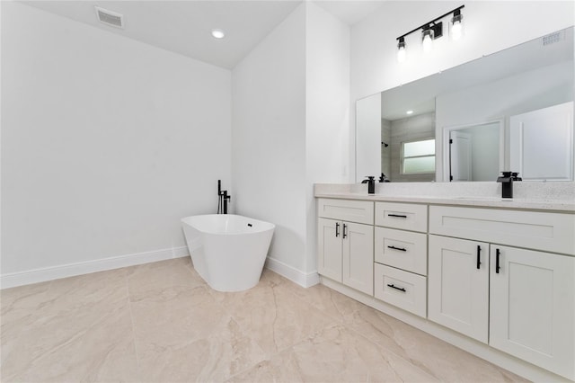 9312 N Akola Way, Citrus Springs, FL 34434 - full bath with double vanity, a stall shower, a soaking tub, marble finish flooring, and recessed lighting