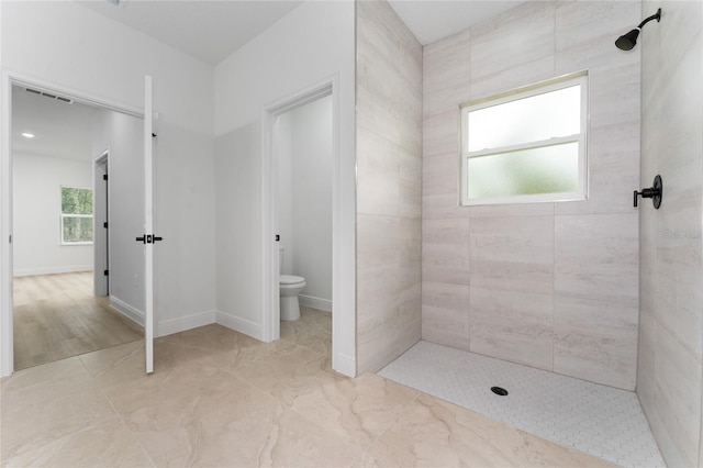 9312 N Akola Way, Citrus Springs, FL 34434 - bathroom featuring tiled shower and toilet