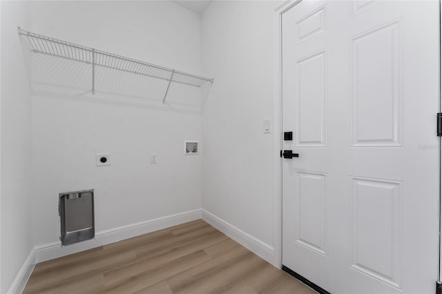 9312 N Akola Way, Citrus Springs, FL 34434 - laundry room featuring hookup for an electric dryer, washer hookup, and light wood-style floors