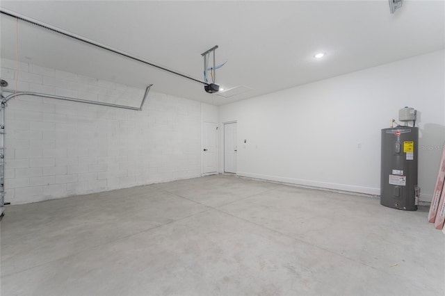 9312 N Akola Way, Citrus Springs, FL 34434 - garage featuring electric water heater, a garage door opener, and concrete block wall