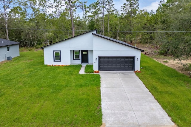 9312 N Akola Way, Citrus Springs, FL 34434 - view of front of property featuring driveway, a garage, a front lawn, stucco siding, and a view of trees
