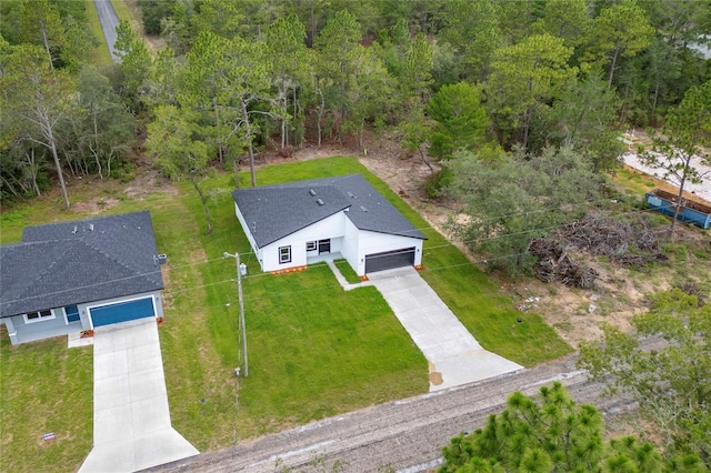 9312 N Akola Way, Citrus Springs, FL 34434 - aerial view of property and surrounding area with a heavily wooded area