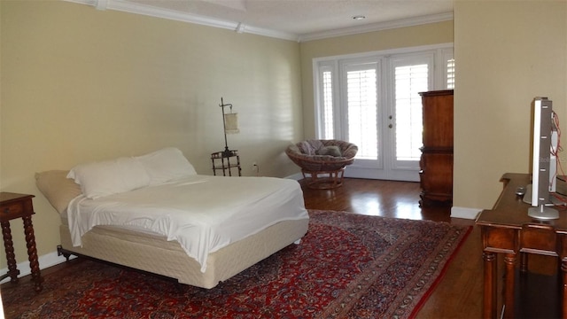 1144 Delaney Ave Unit 1144, Orlando, FL 32806 - bedroom with crown molding, wood finished floors, and access to outside