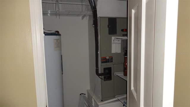 1144 Delaney Ave Unit 1144, Orlando, FL 32806 - utility room featuring water heater and heating unit