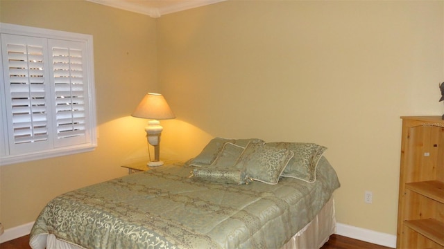 1144 Delaney Ave Unit 1144, Orlando, FL 32806 - bedroom with wood finished floors and ornamental molding