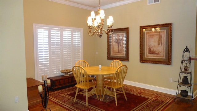 1144 Delaney Ave Unit 1144, Orlando, FL 32806 - dining area with wood finished floors, a chandelier, and ornamental molding