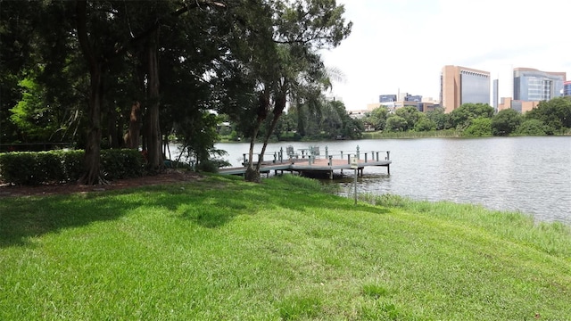 1144 Delaney Ave Unit 1144, Orlando, FL 32806 - dock area featuring a water view and a yard