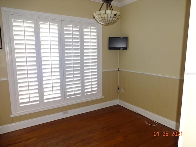 1144 Delaney Ave Unit 1144, Orlando, FL 32806 - unfurnished dining area featuring wood finished floors and baseboards