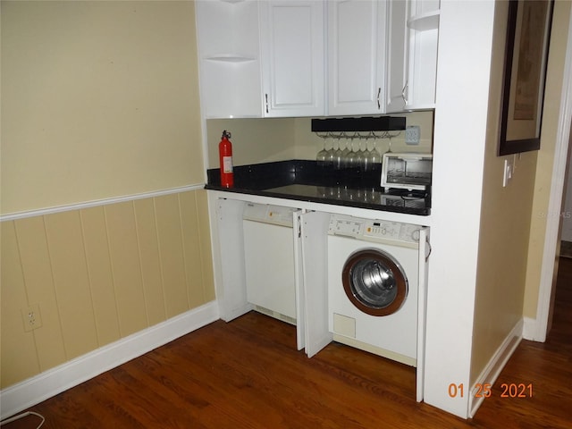 1144 Delaney Ave Unit 1144, Orlando, FL 32806 - kitchen with washer / clothes dryer, open shelves, dark wood-type flooring, white cabinets, and dark countertops