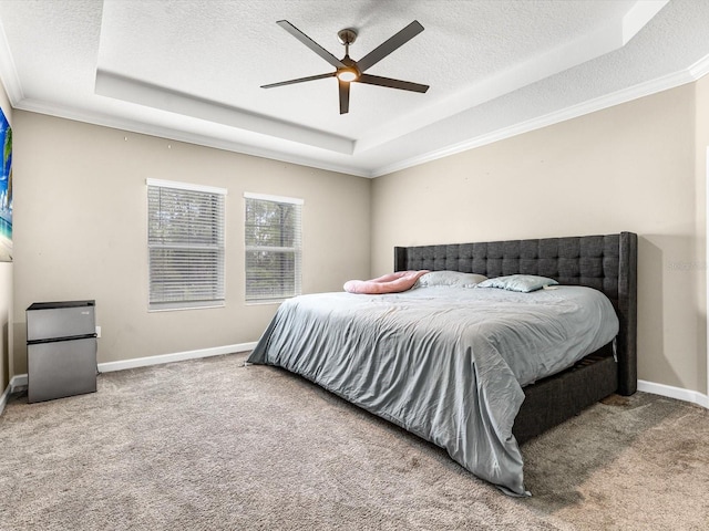 2452 Camden Park Ave, Davenport, FL 33837 - bedroom featuring a raised ceiling, a textured ceiling, carpet floors, crown molding, and freestanding refrigerator