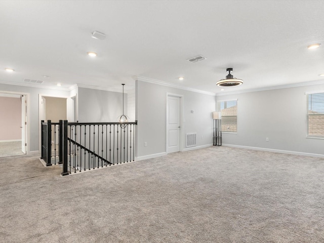 2452 Camden Park Ave, Davenport, FL 33837 - spare room featuring crown molding, carpet, plenty of natural light, and recessed lighting