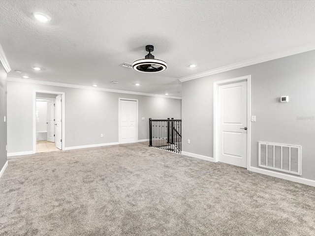 2452 Camden Park Ave, Davenport, FL 33837 - unfurnished living room with light carpet, recessed lighting, ornamental molding, a textured ceiling, and ceiling fan