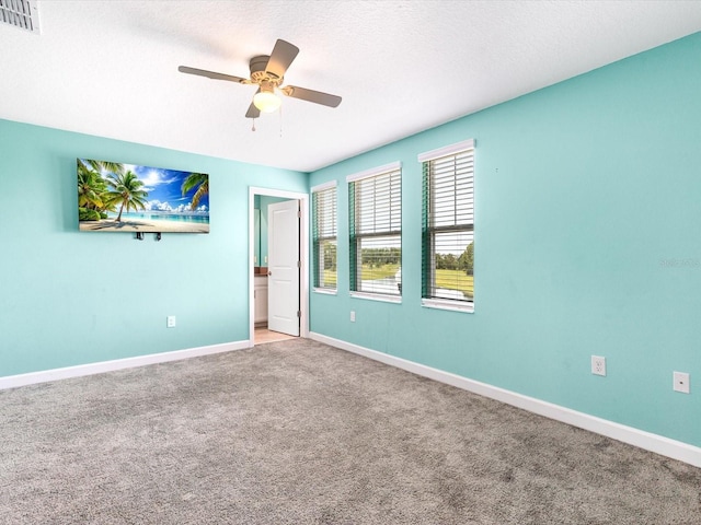 2452 Camden Park Ave, Davenport, FL 33837 - unfurnished bedroom with carpet and ceiling fan