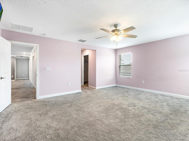 2452 Camden Park Ave, Davenport, FL 33837 - carpeted spare room featuring a ceiling fan and a textured ceiling