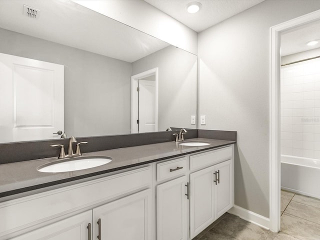 2452 Camden Park Ave, Davenport, FL 33837 - full bathroom with double vanity, tile patterned flooring, and bathtub / shower combination