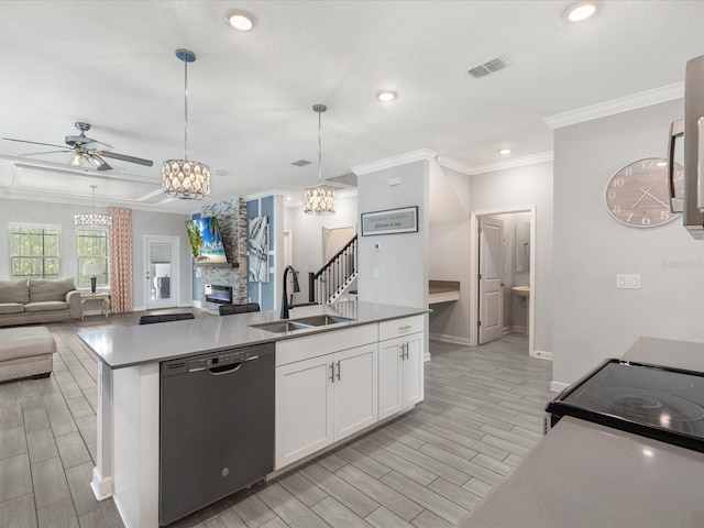 2452 Camden Park Ave, Davenport, FL 33837 - kitchen featuring dishwasher, ceiling fan, open floor plan, ornamental molding, and white cabinetry