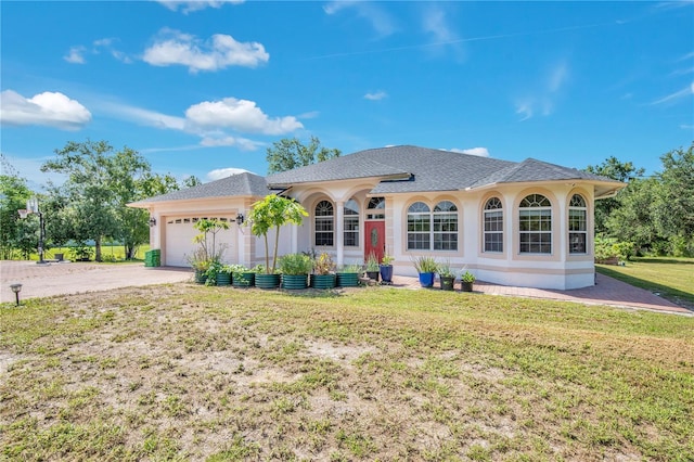 18852 Starry St, Orlando, FL 32833 - ranch-style home featuring driveway, an attached garage, a front yard, and a shingled roof