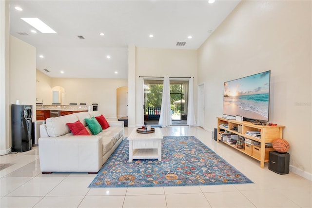 18852 Starry St, Orlando, FL 32833 - living area featuring arched walkways, recessed lighting, and light tile patterned flooring