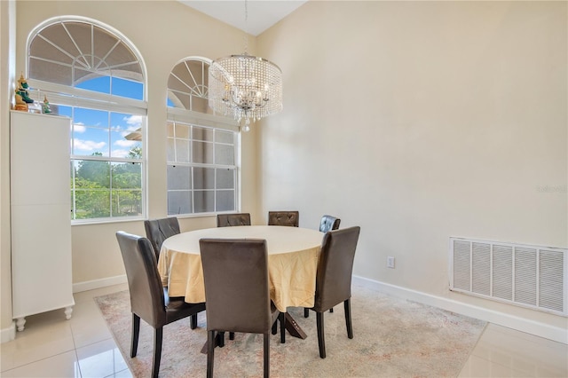 18852 Starry St, Orlando, FL 32833 - tiled dining area featuring a chandelier and baseboards