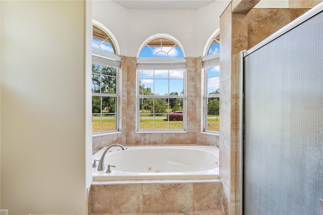 18852 Starry St, Orlando, FL 32833 - bathroom with a shower stall and a jetted tub
