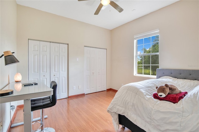 18852 Starry St, Orlando, FL 32833 - bedroom featuring two closets, light wood-style floors, and a ceiling fan