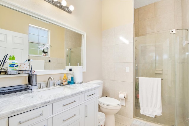 18852 Starry St, Orlando, FL 32833 - full bathroom featuring a stall shower, vanity, tile patterned flooring, and tile walls