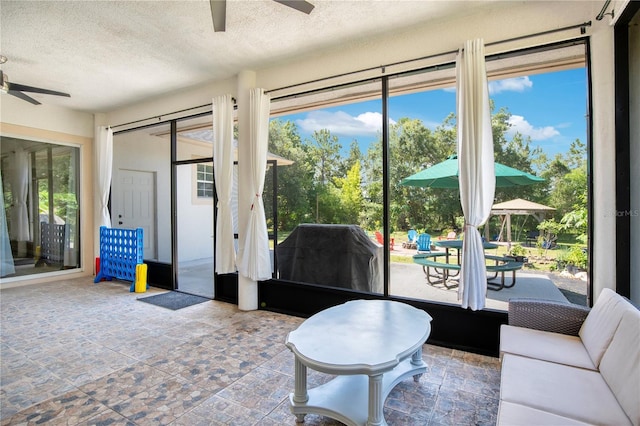18852 Starry St, Orlando, FL 32833 - living area featuring a ceiling fan and a textured ceiling