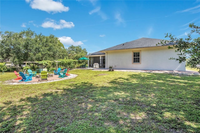 18852 Starry St, Orlando, FL 32833 - view of green lawn with a patio and an outdoor fire pit
