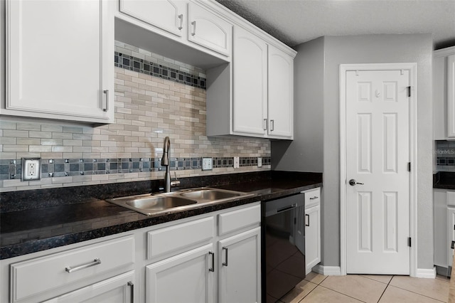 2885 Lafayette Trace Dr, Saint Cloud, FL 34772 - kitchen featuring black dishwasher, white cabinets, light tile patterned flooring, backsplash, and dark countertops