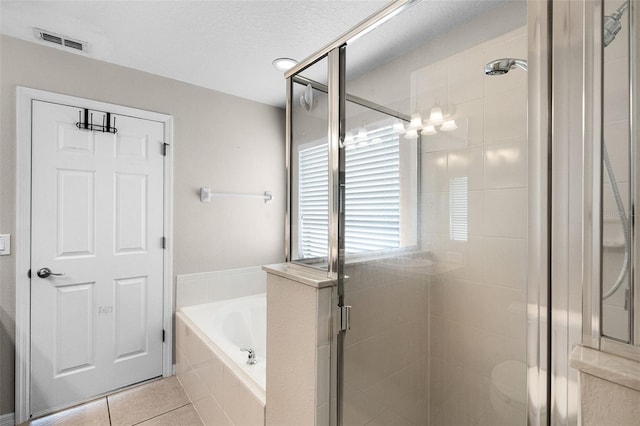 2885 Lafayette Trace Dr, Saint Cloud, FL 34772 - full bathroom featuring a bath, a shower stall, and tile patterned flooring