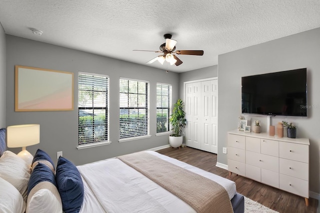 2885 Lafayette Trace Dr, Saint Cloud, FL 34772 - bedroom with wood finished floors, a closet, a ceiling fan, and a textured ceiling