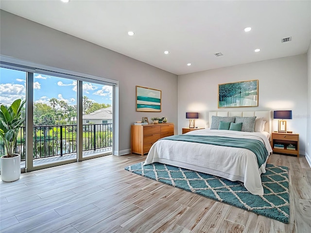 1329 Jumana Loop, Apollo Beach, FL 33572 - bedroom with access to outside, light wood finished floors, and recessed lighting
