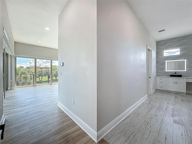 1329 Jumana Loop, Apollo Beach, FL 33572 - hallway with light wood-style flooring and recessed lighting