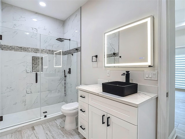 1329 Jumana Loop, Apollo Beach, FL 33572 - bathroom featuring a marble finish shower, vanity, and recessed lighting