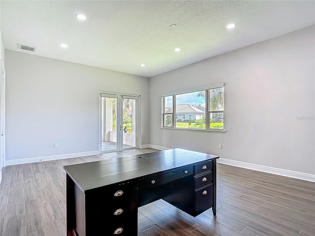 1329 Jumana Loop, Apollo Beach, FL 33572 - unfurnished office with light wood-style floors, recessed lighting, and a textured ceiling