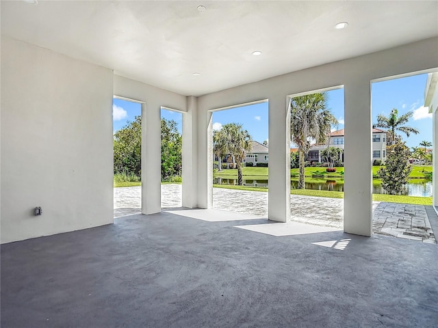 1329 Jumana Loop, Apollo Beach, FL 33572 - unfurnished living room with a water view, a residential view, and recessed lighting