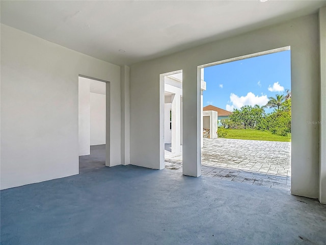 1329 Jumana Loop, Apollo Beach, FL 33572 - unfurnished living room featuring concrete flooring