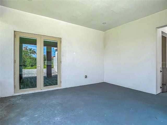 1329 Jumana Loop, Apollo Beach, FL 33572 - spare room with concrete floors and french doors
